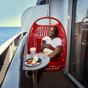 cell phone, virgin voyages, red hammock